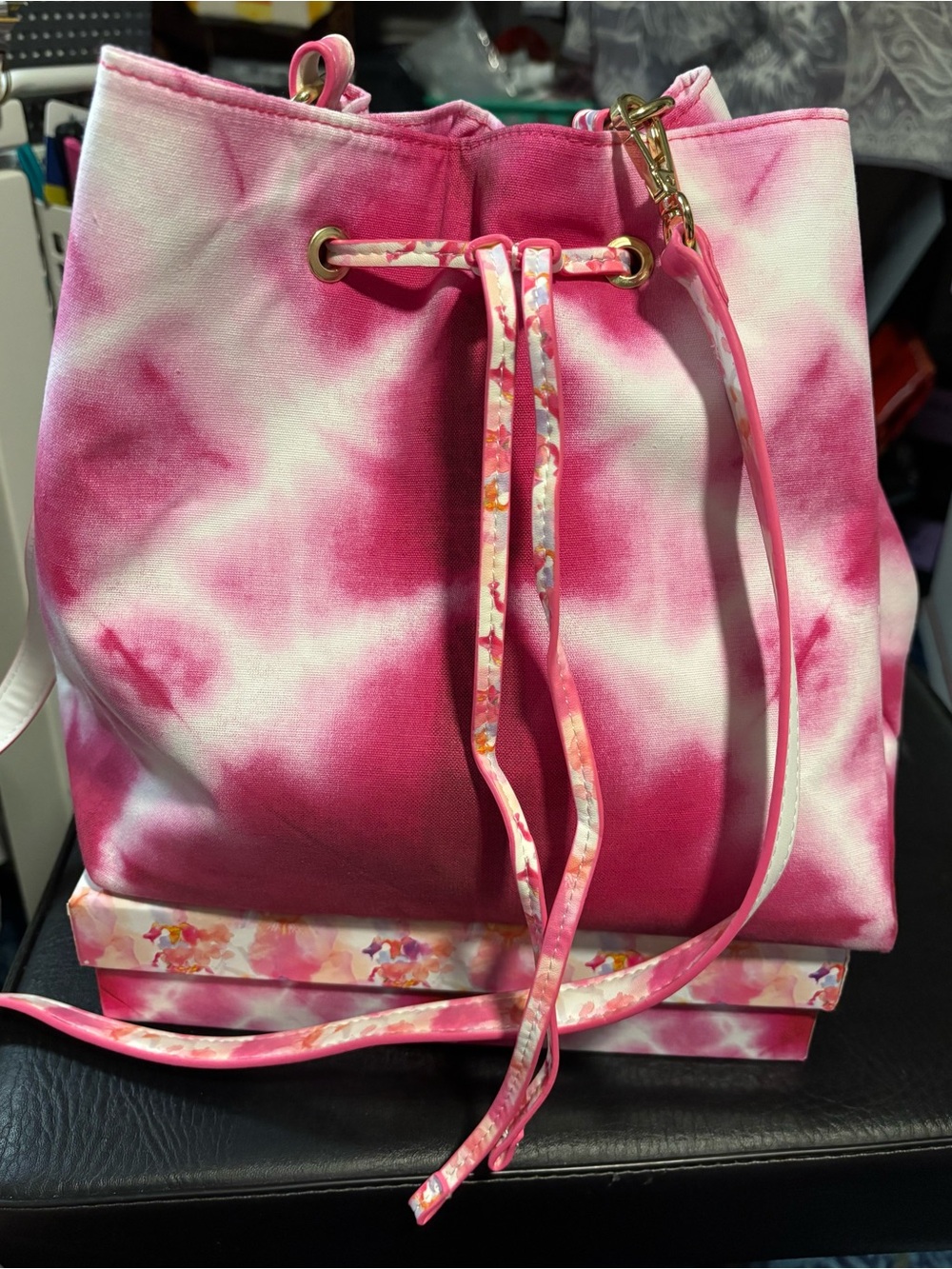 Estee Lauder pink tie-dye drawstring bucket bag